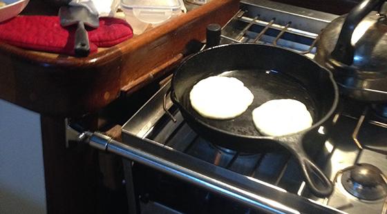 pancakes cooking on stove
